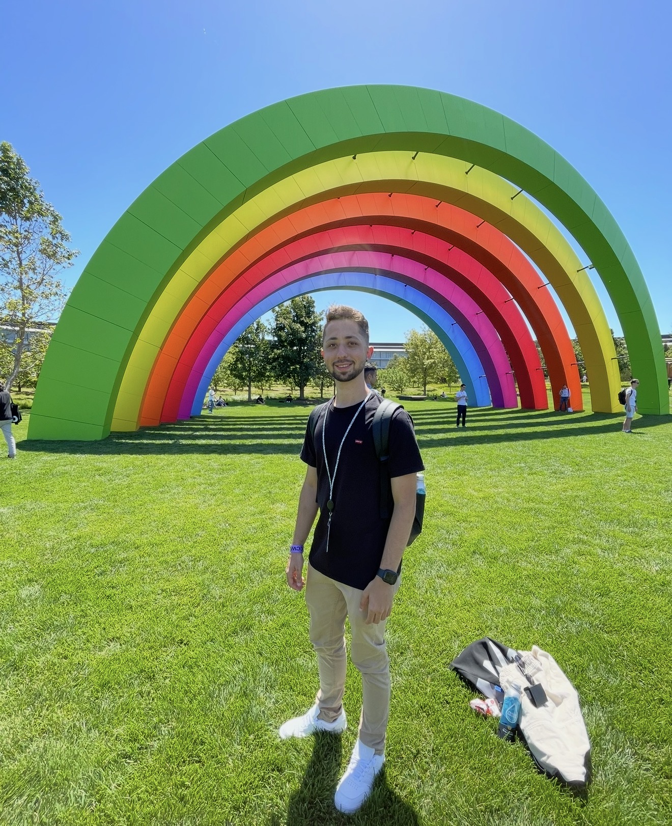 Standing under the rainbow installation at Apple Park